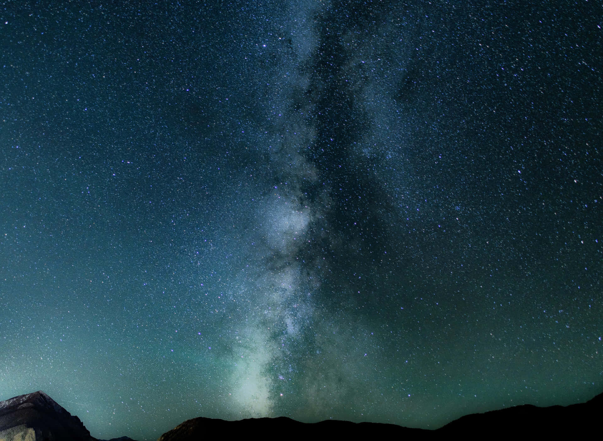Explore The Polychromatic Beauty Of The Green And Blue Galaxy Background