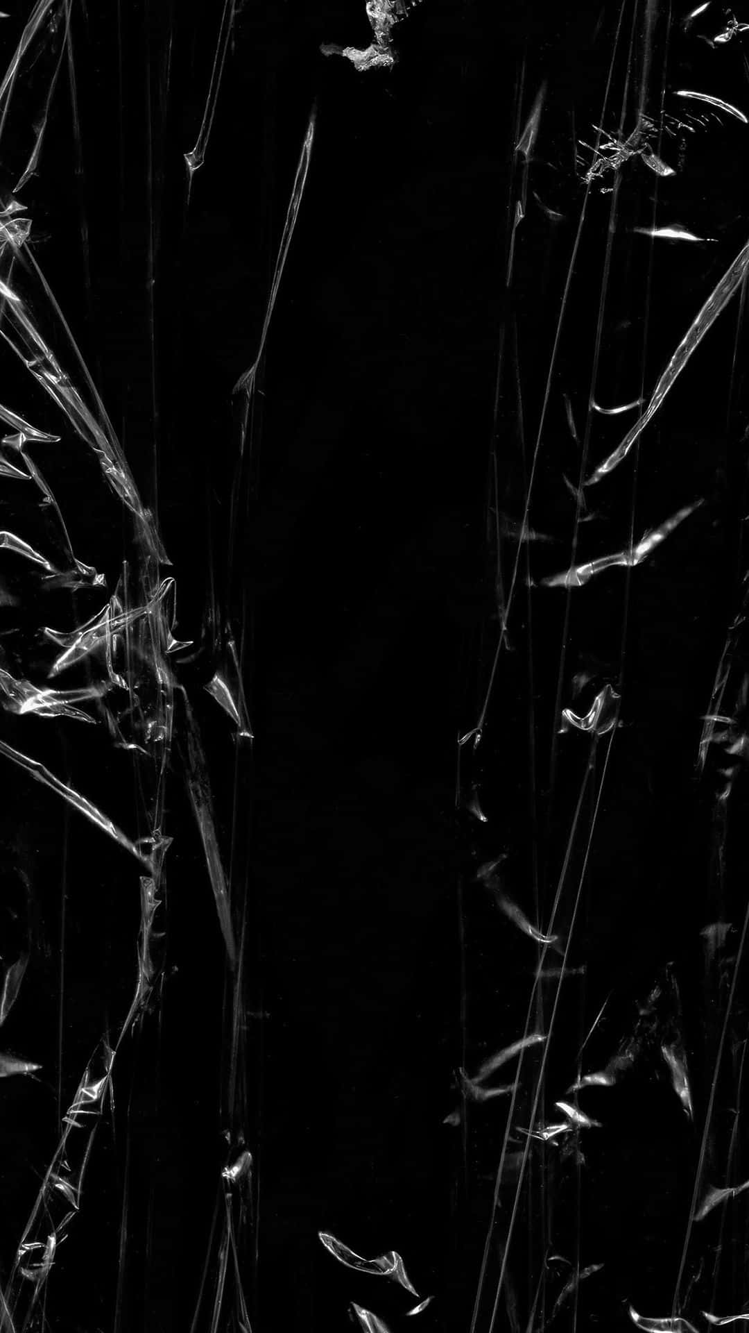 Explore The Strange And Surreal With This Black Plastic Figure. Background