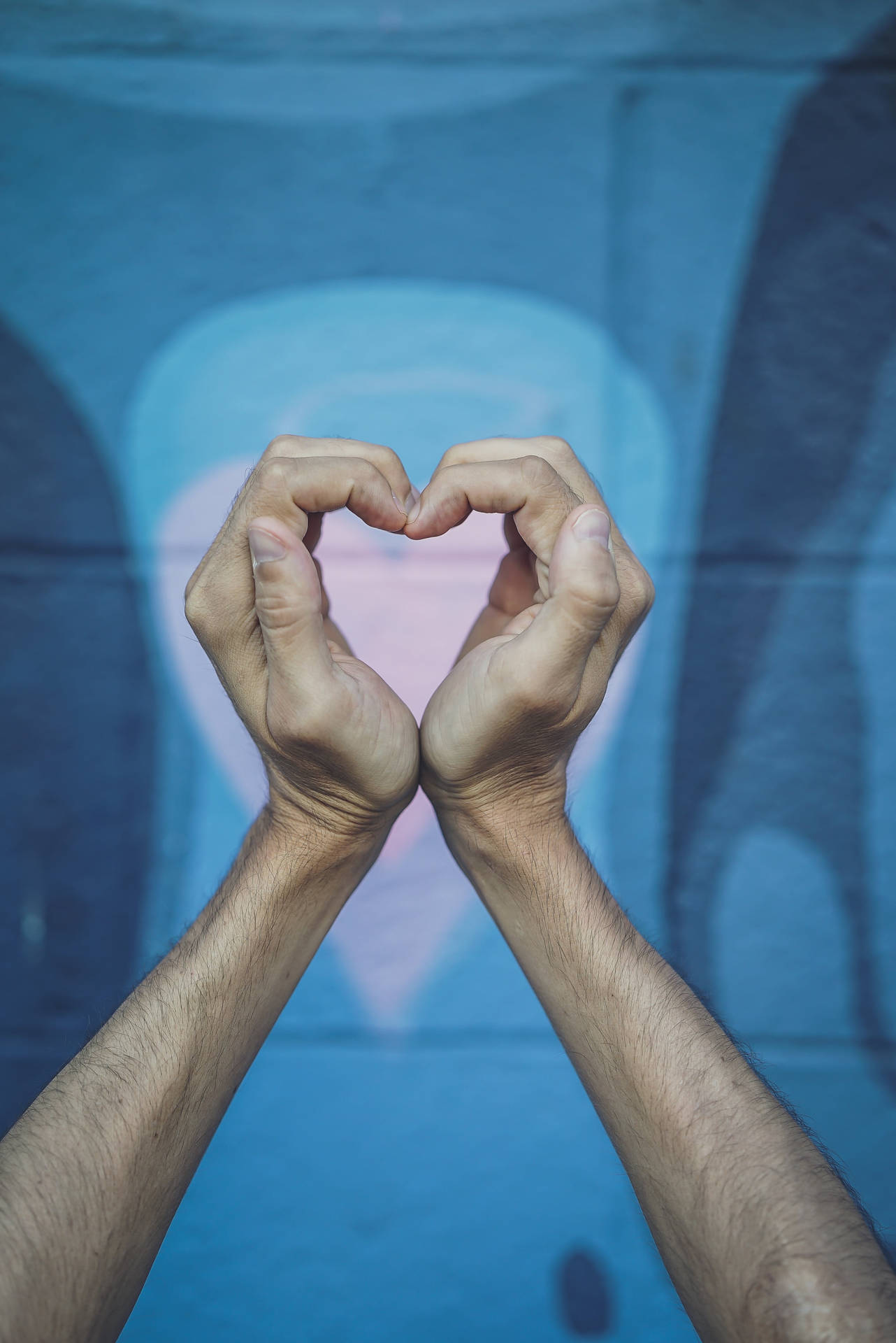 Expressing Love With A Finger Heart Reflection In The Mirror Background