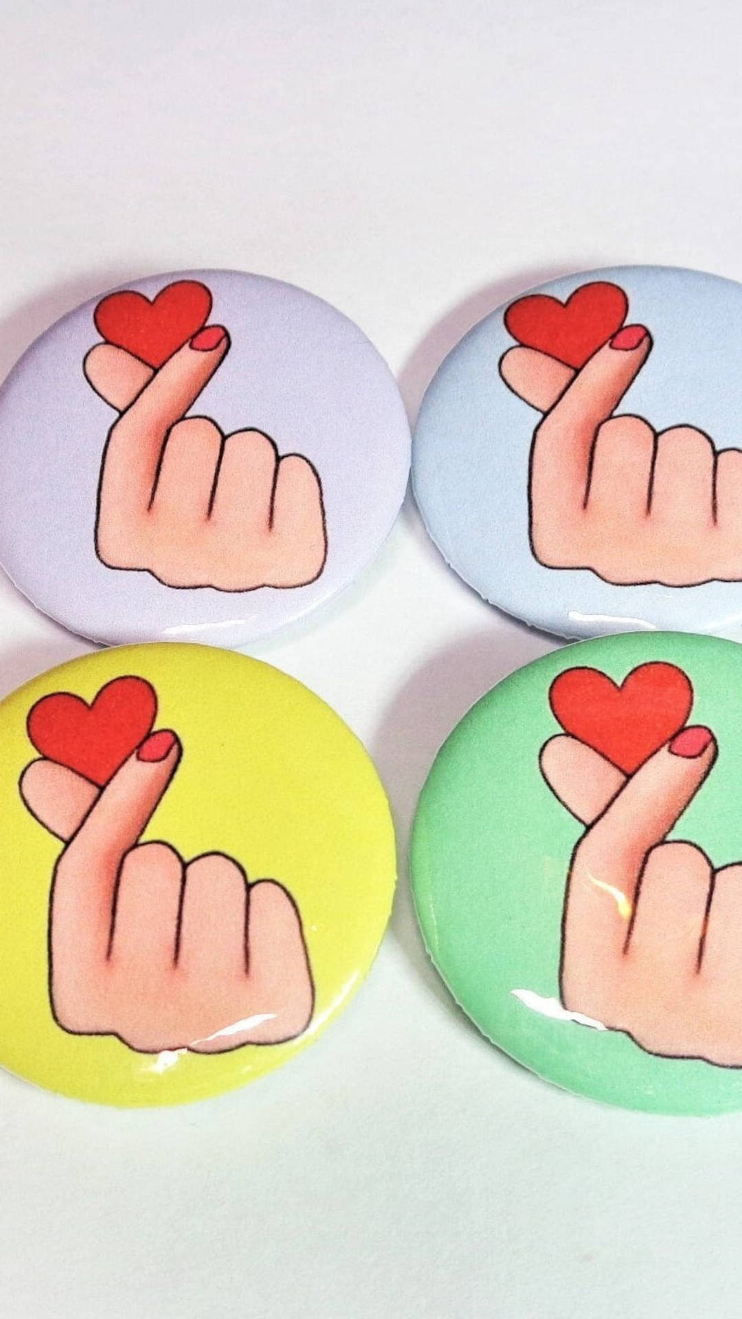 Expressing Love With A Saranghae Finger Heart Pin. Background