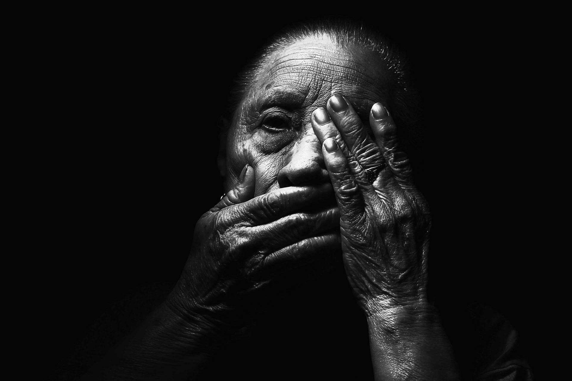 Expressive Portrait Of A Wise Elderly Woman Background