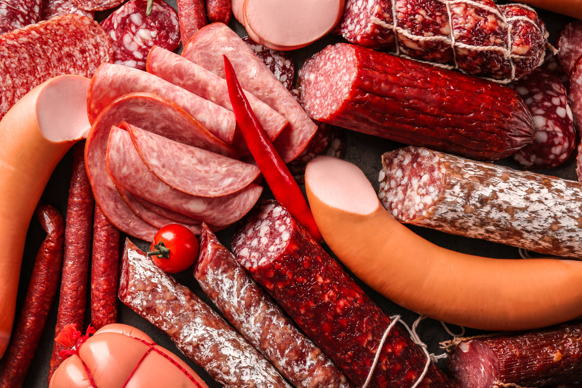 Exquisite Assortment Of Cold Meats Up Close Background