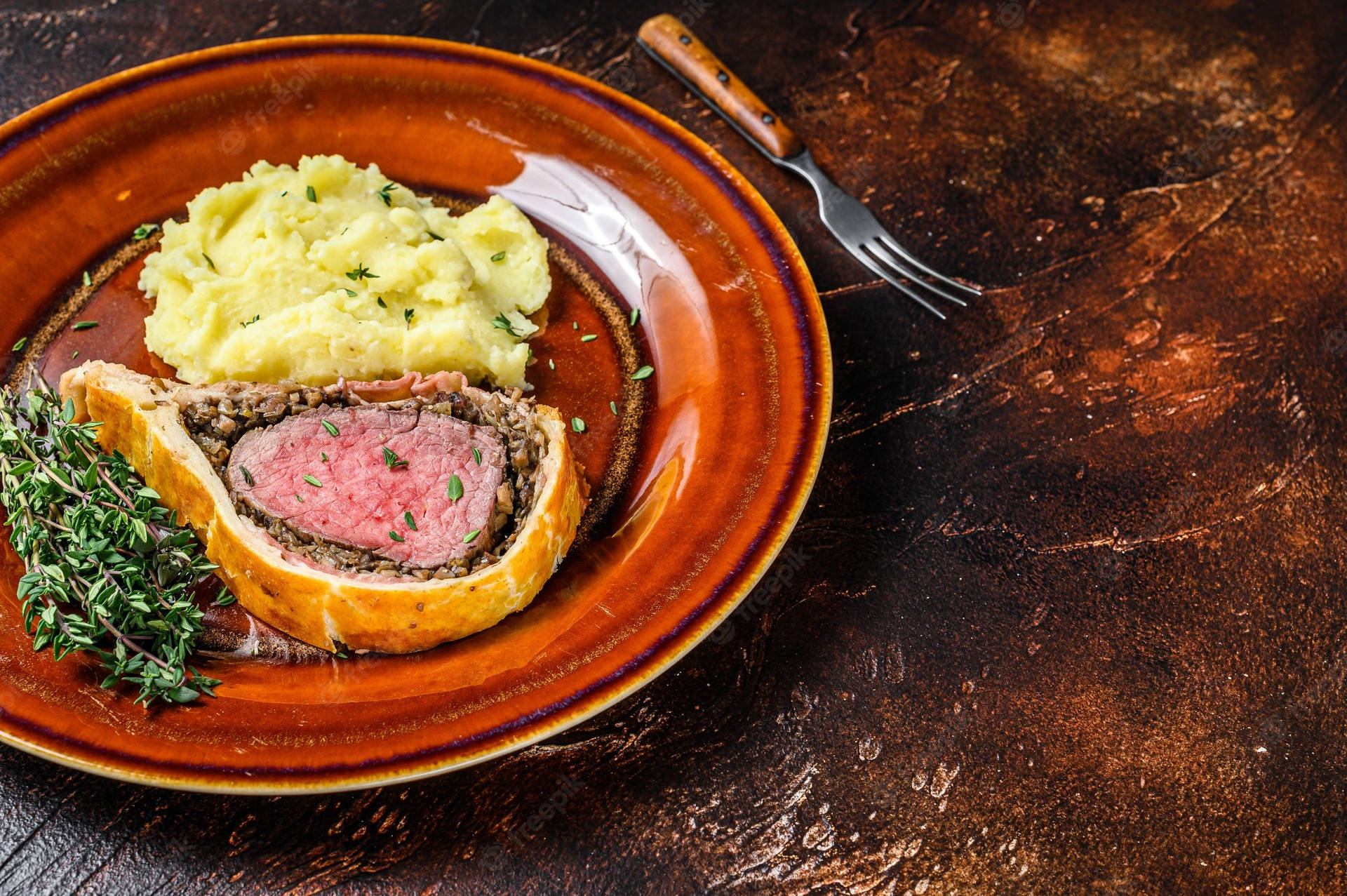 Exquisite Beef Wellington On A Combination Plate Background