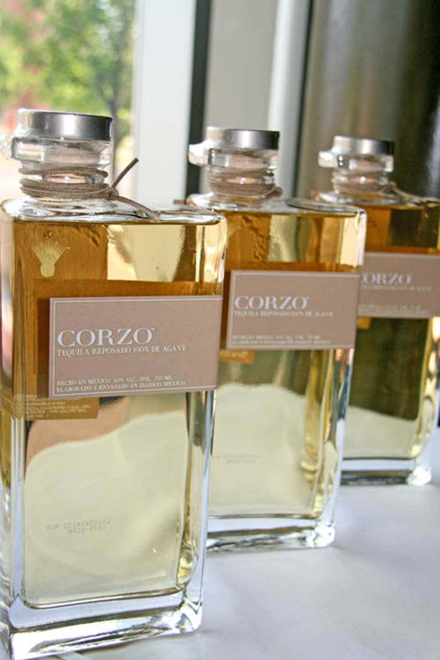 Exquisite Bottle Of Corzo Reposado Tequila Background