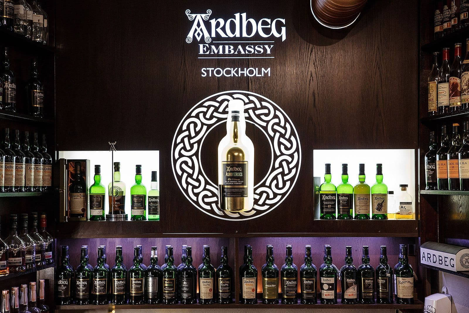 Exquisite Collection Of Ardbeg Whisky At The Ardbeg Embassy, Stockholm Background