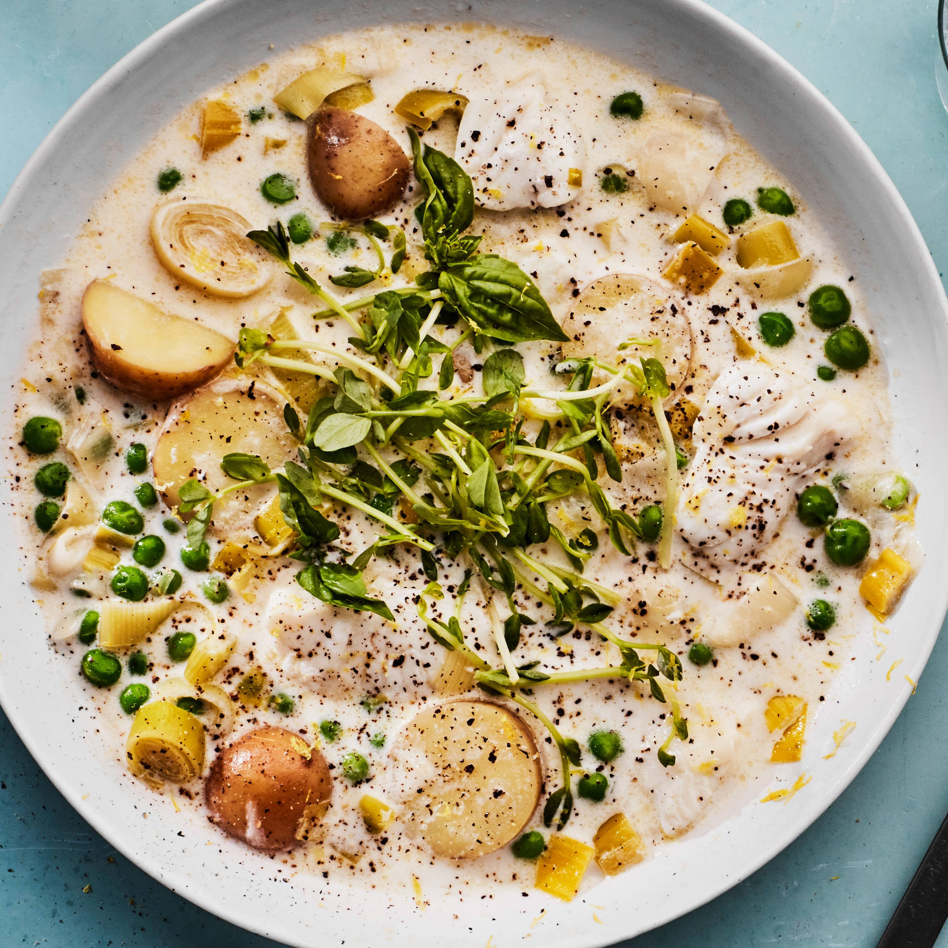 Exquisite Fish Chowder Garnished With Fresh Peas