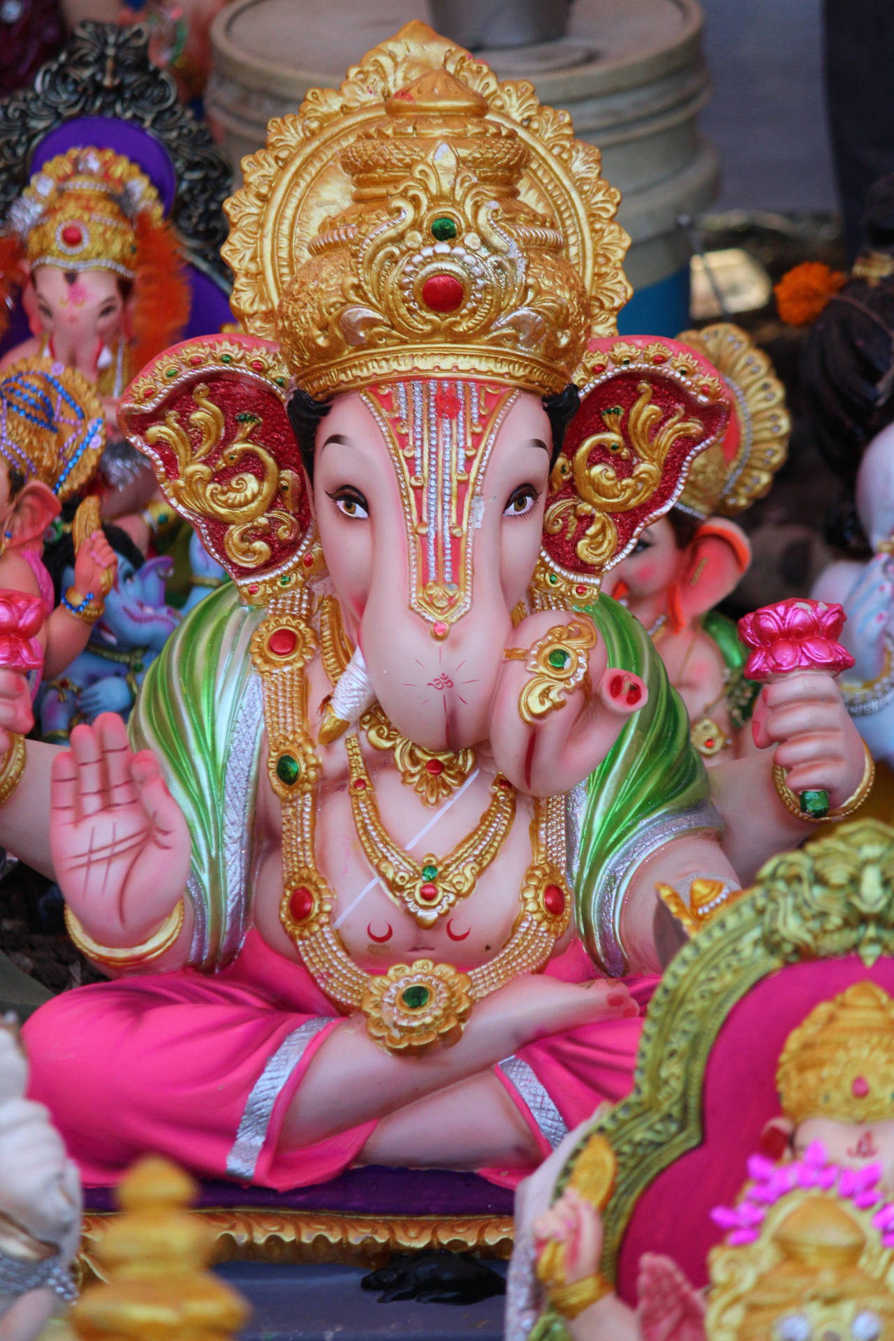 Exquisite Ganesh Statuette On A Mobile Device Background