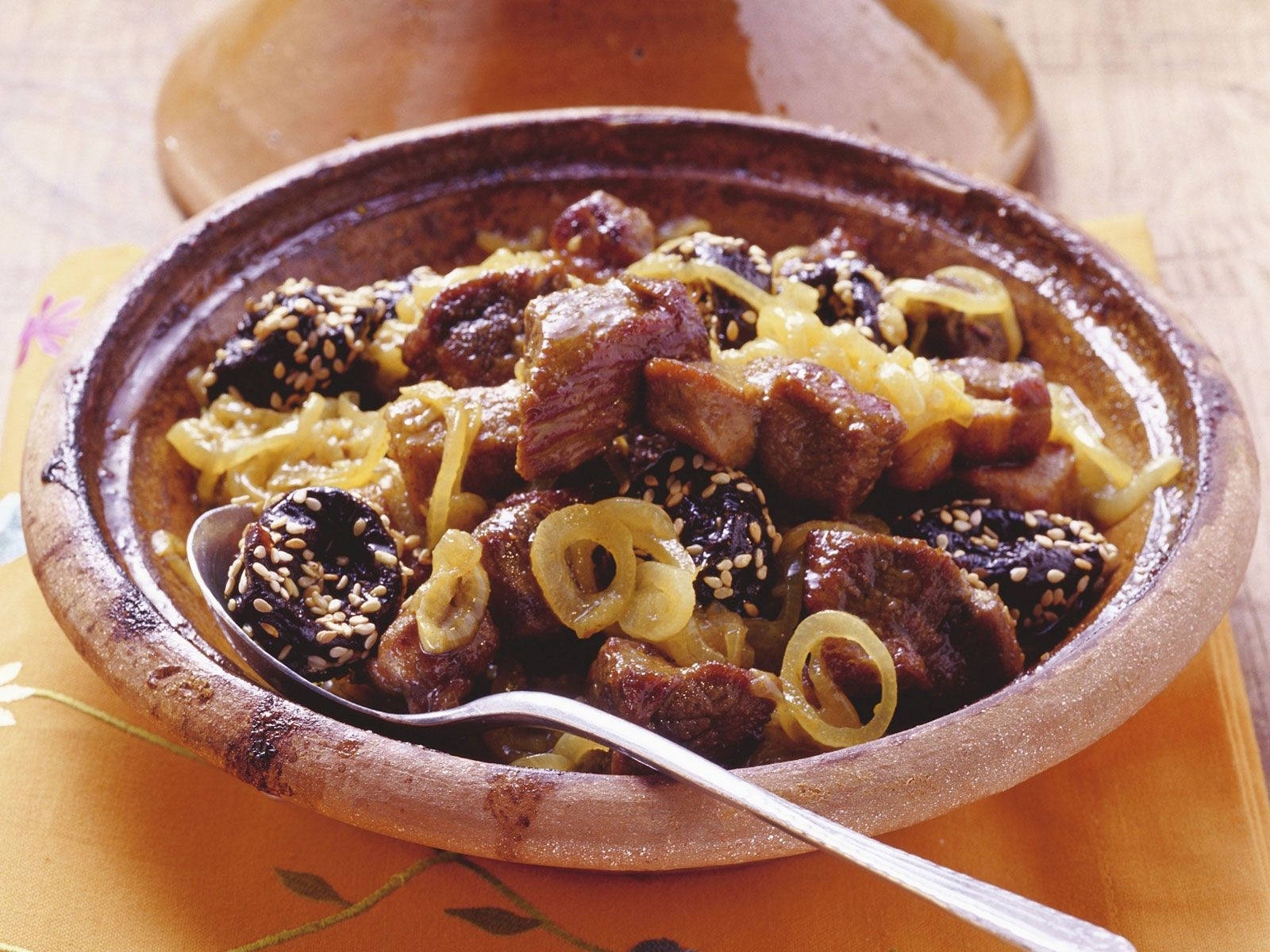 Exquisite Meat Tajine With Olives And Onion Background