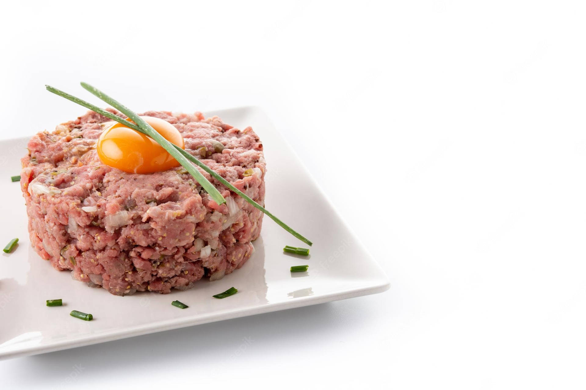 Exquisite Steak Tartare With Vibrant Yolk On Top Background