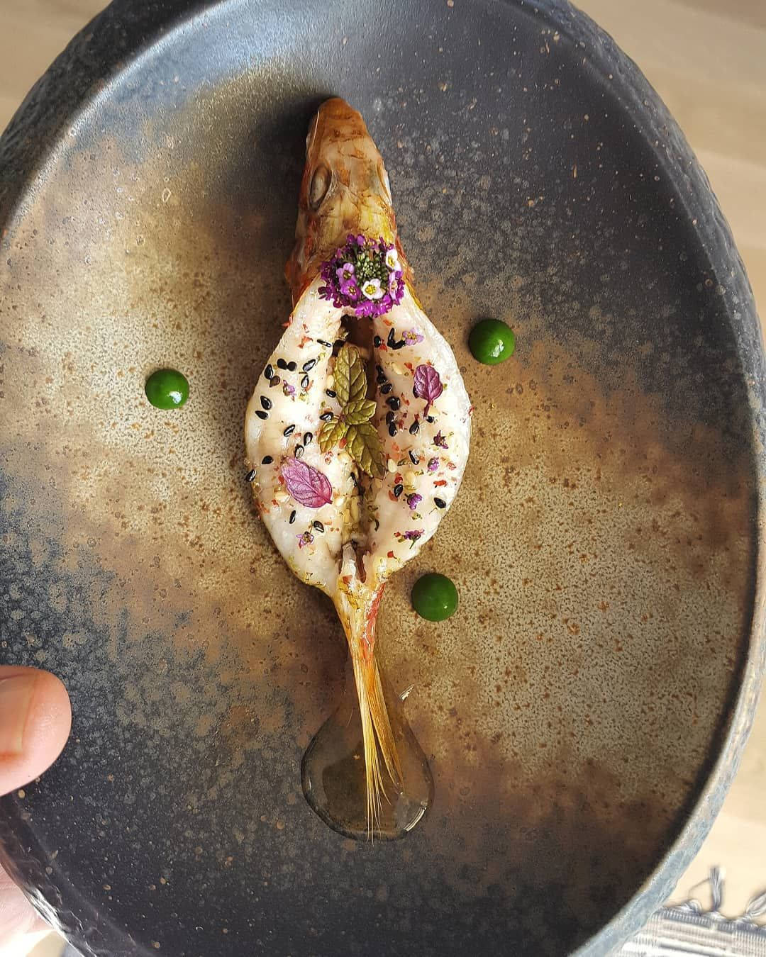 Exquisite Stuffed Mullet On A Gourmet Table Background