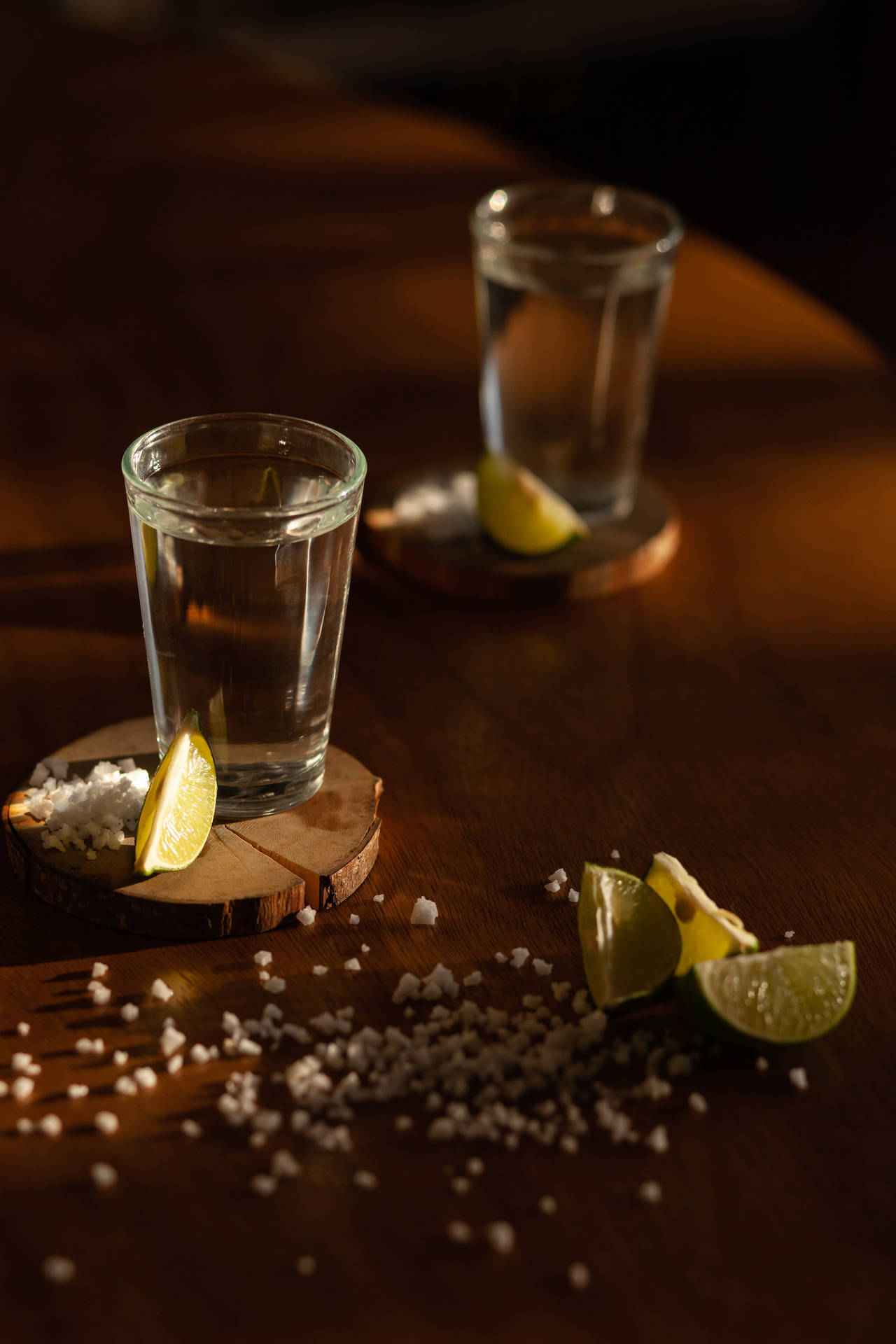 Exquisite Tequila Shots Served With Lime And Salt Background