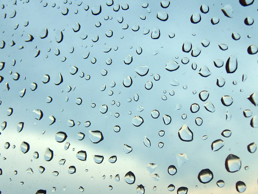 Extreme Close Up Glass Raindrops Background