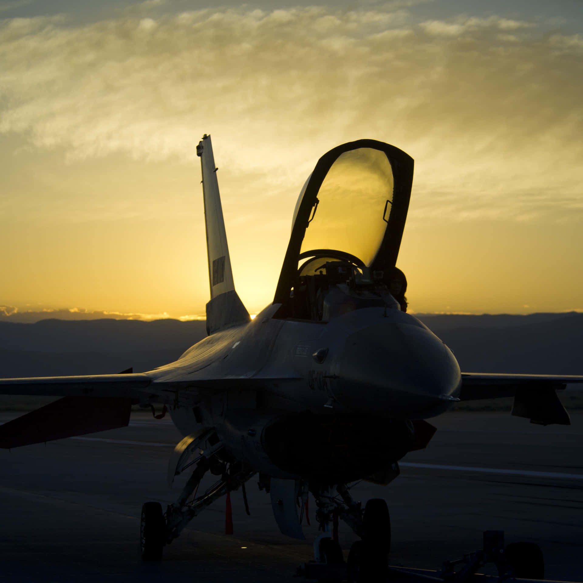 F-16 Fighting Falcon Militrary Jet Streaking Across The Sky Background