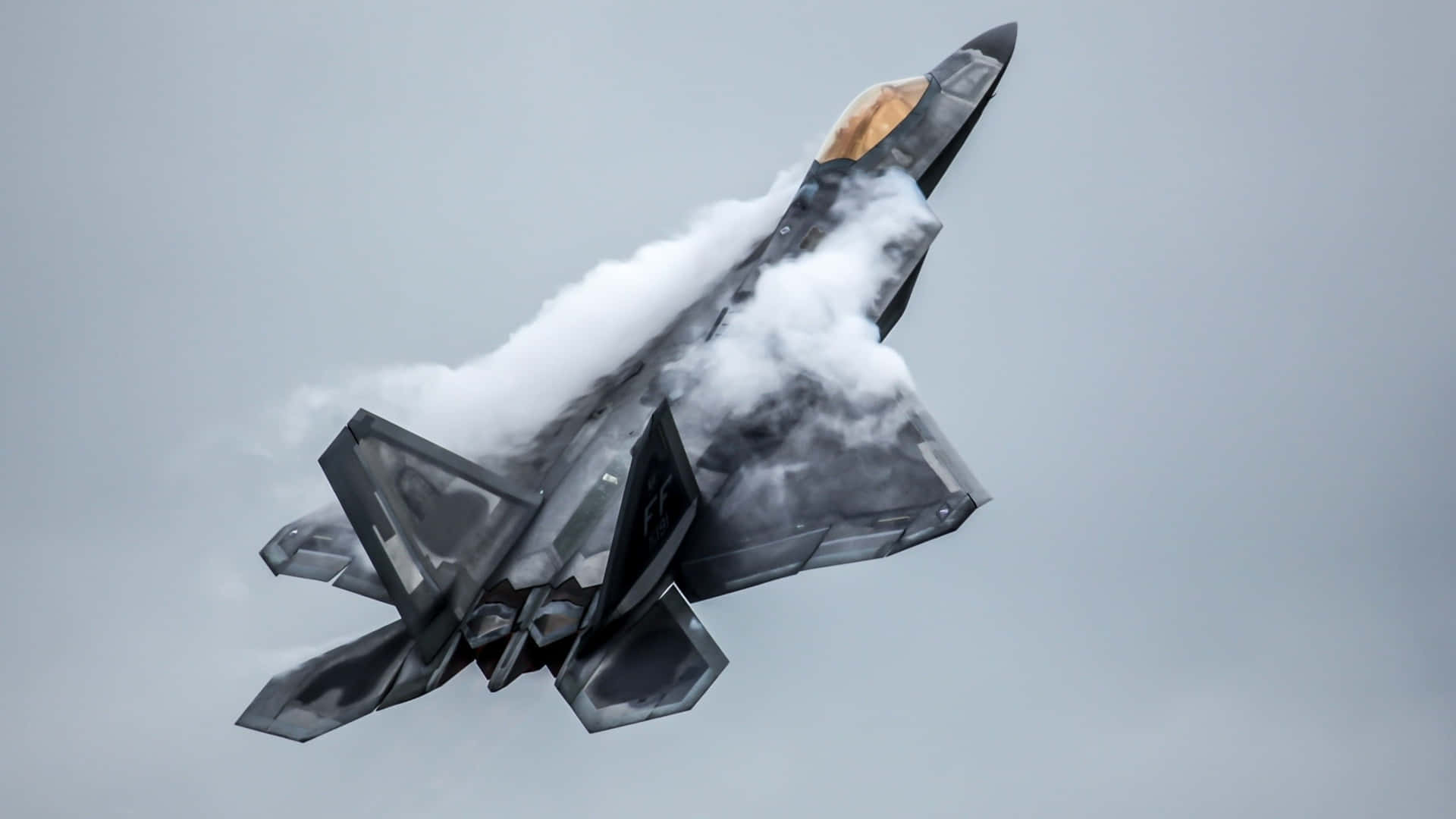 F-22 Raptor Stealth Fighter Jet Flying Over Snowy Mountains Background