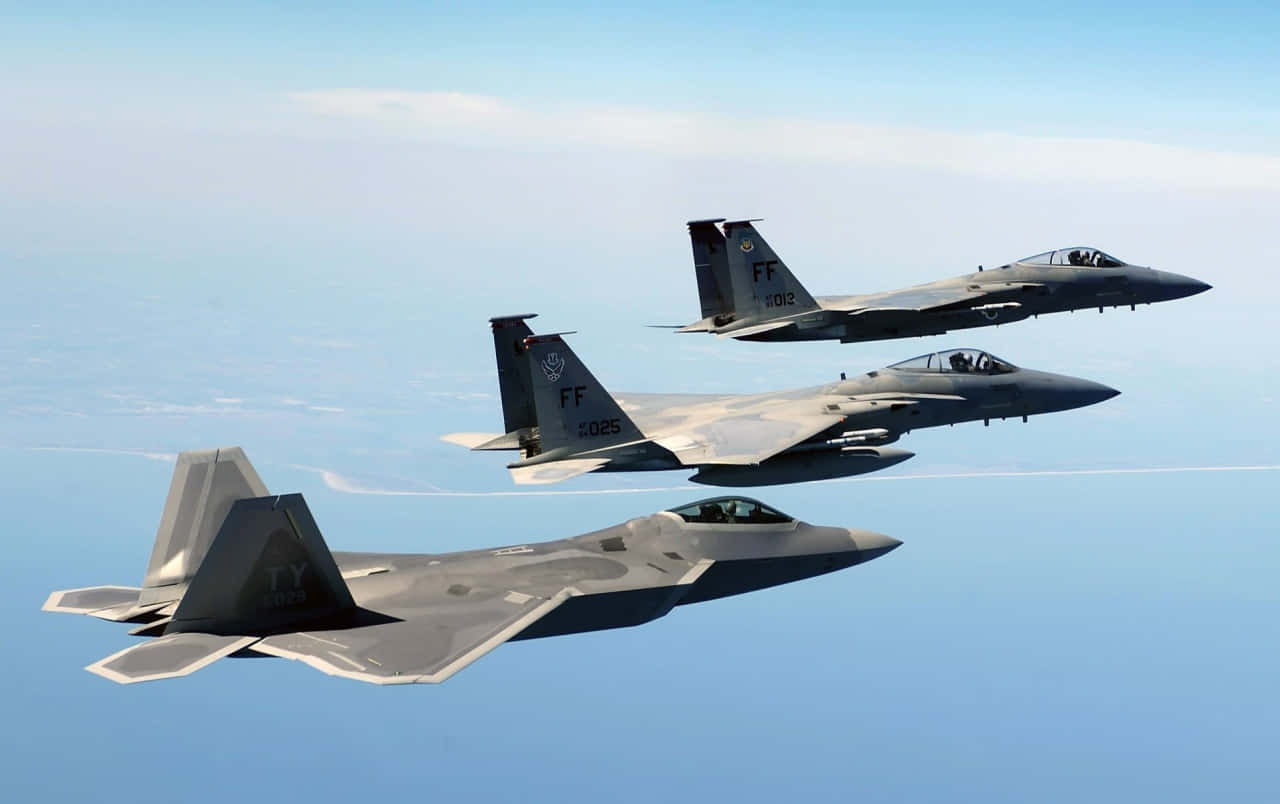 F-22 Raptor Tearing Through The Skies Background