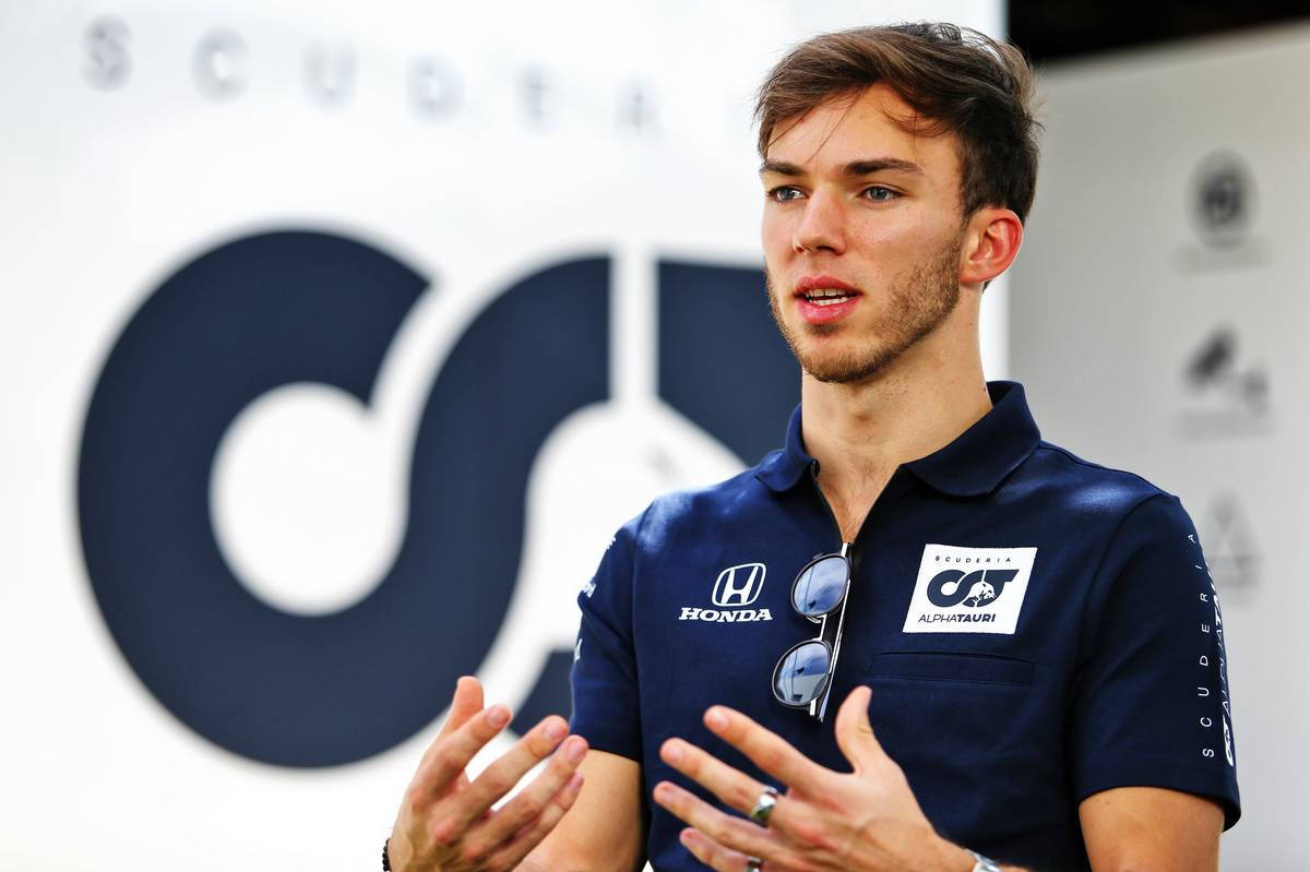 F1 Driver Pierre Gasly Deep In Conversation Background