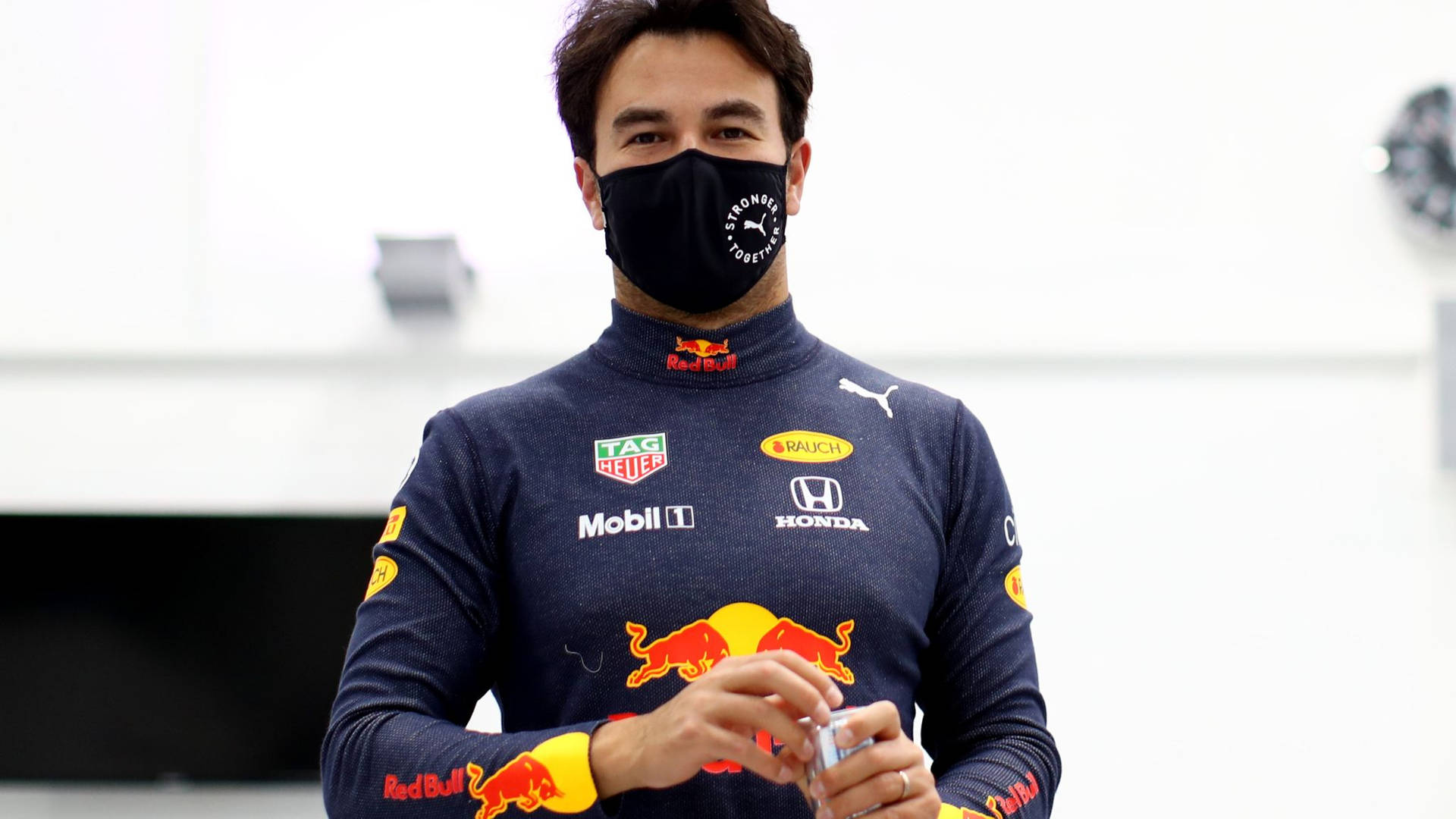 F1 Driver Sergio Perez Wearing A Face Mask