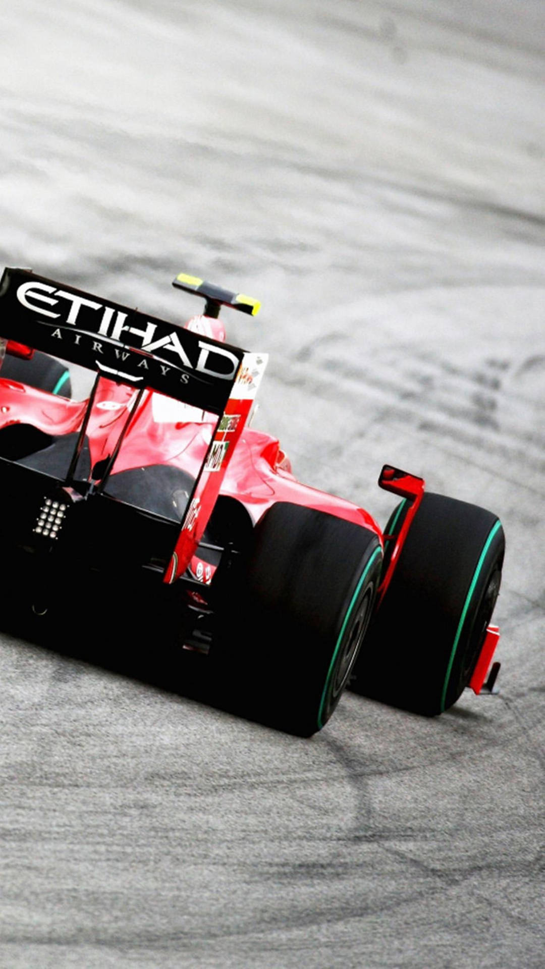 F1 Phone Embracing Speed At The Etihad Red Formula Race Background