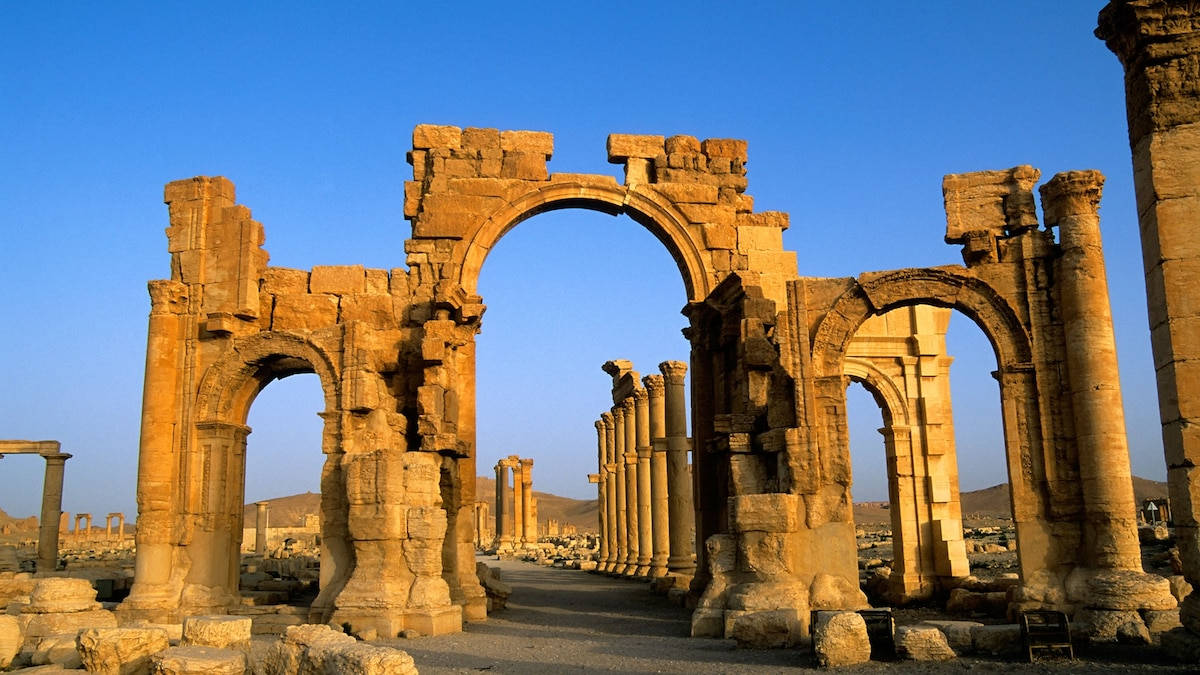 Facade Of The Monumental Arch Of Palmyra Background