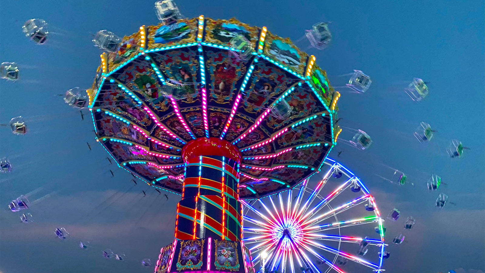 Fair Swing Ride And Ferris Wheel