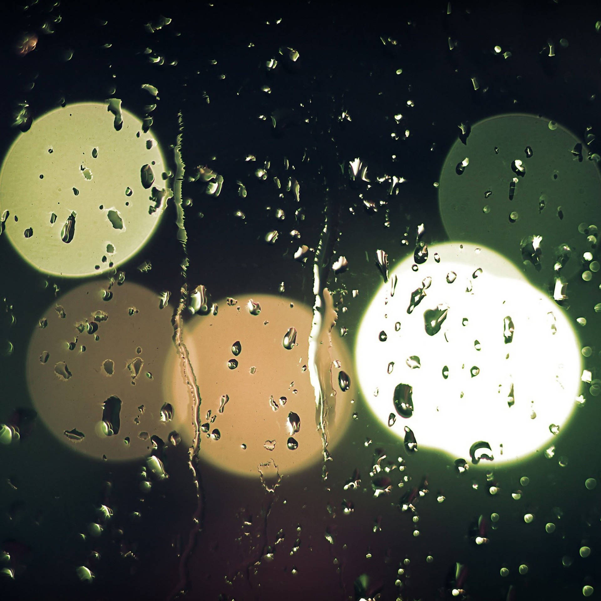 Falling Raindrops With Colorful Light Orbs Background