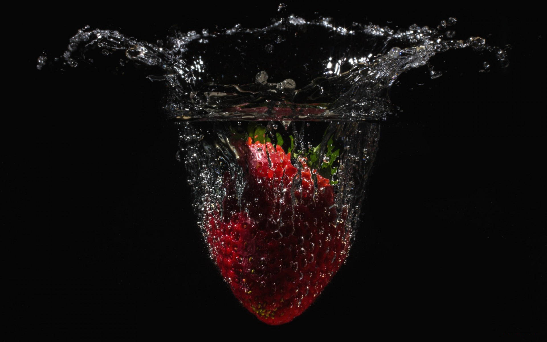 Falling Strawberry In Water Background