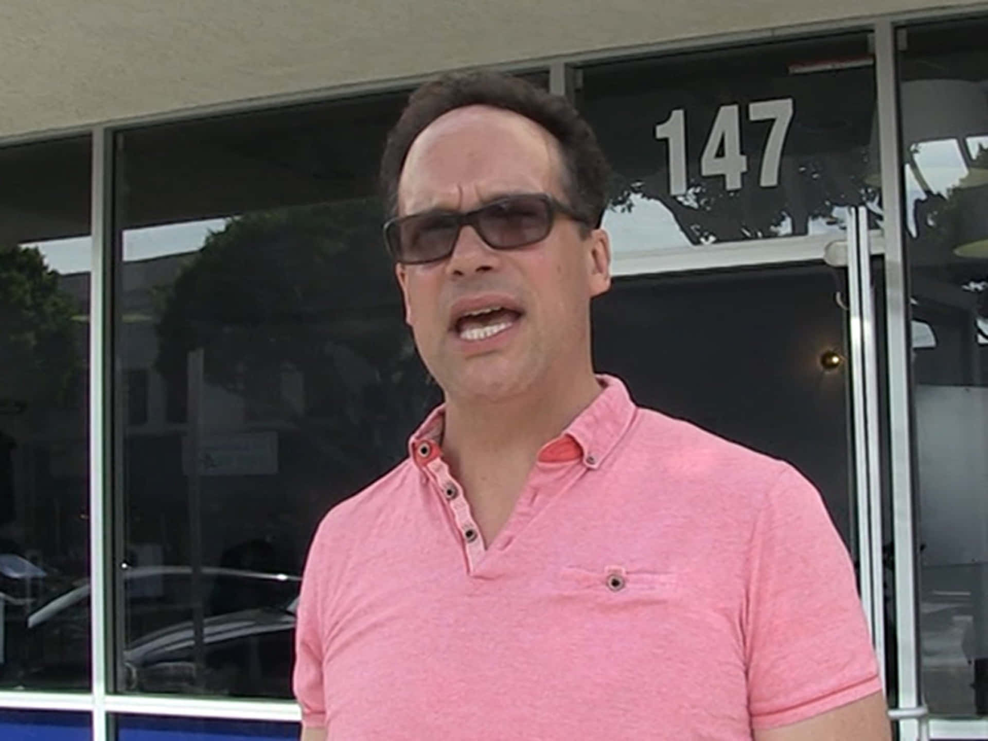 Famed Actor Diedrich Bader In A Reflective Moment Background
