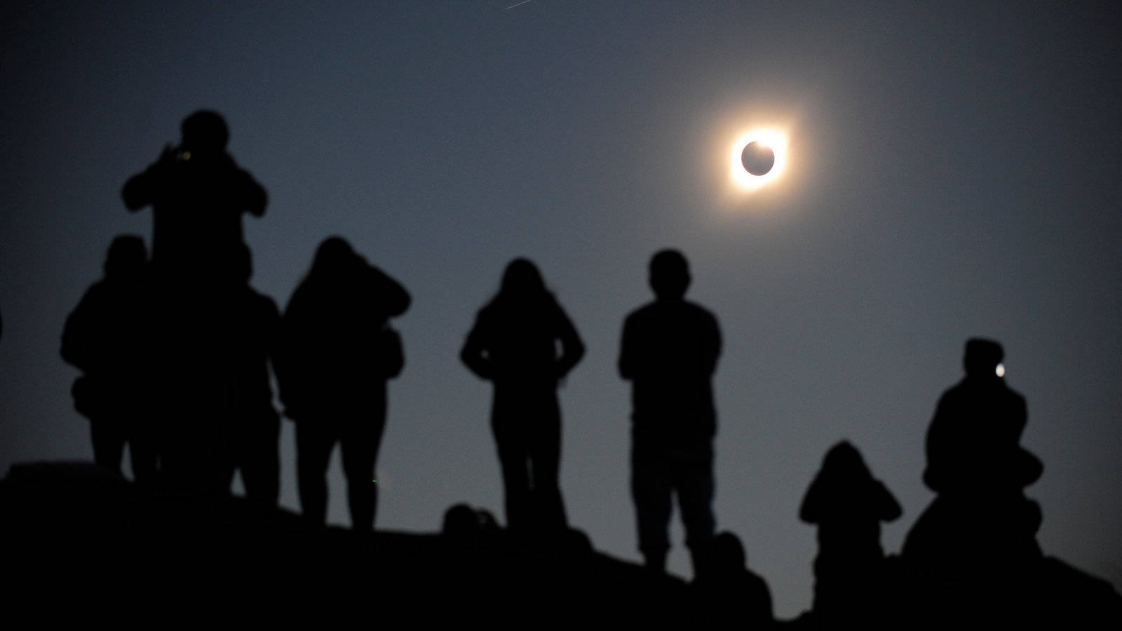 Families Looking At Solar Eclipse Background