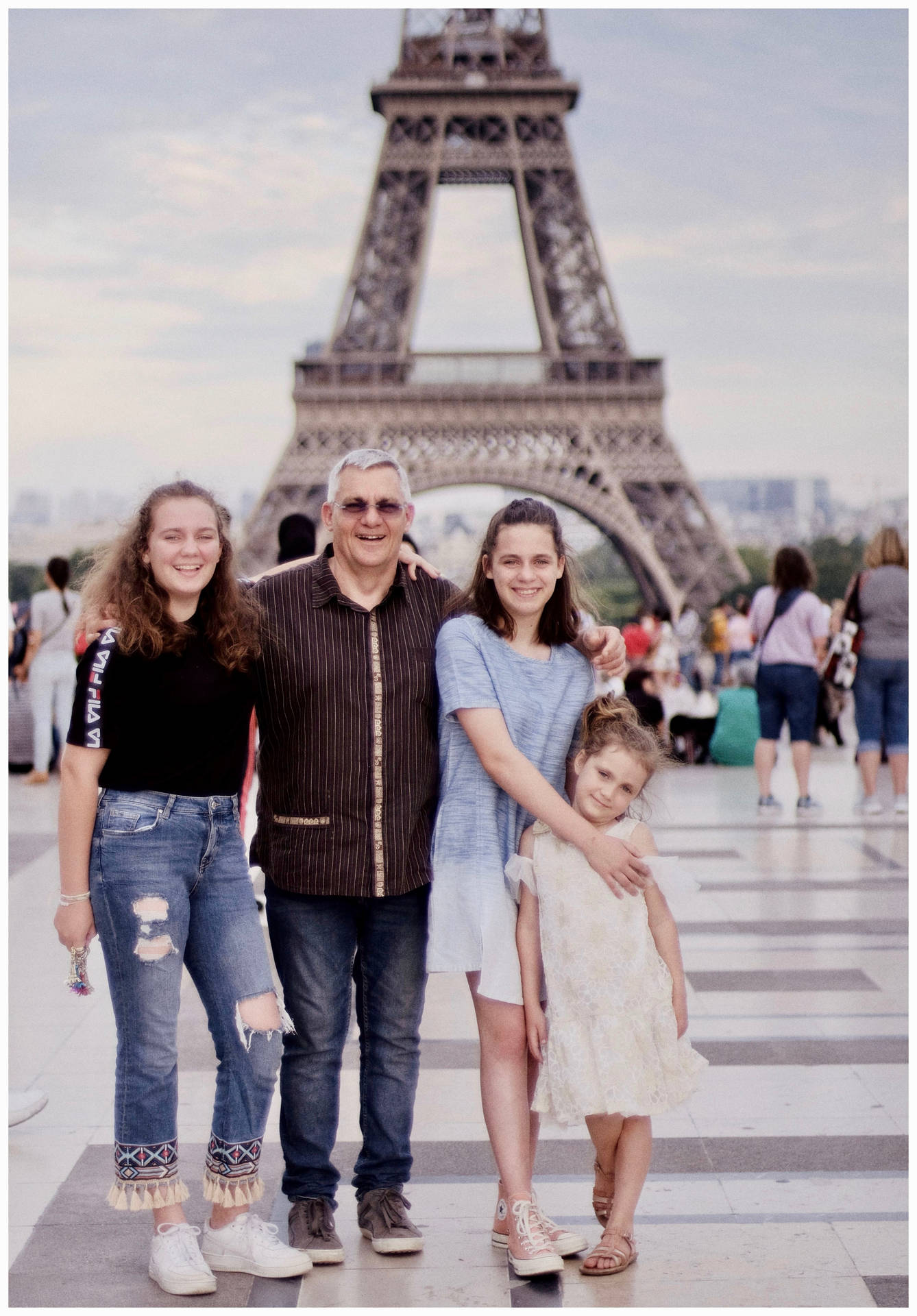 Family With Eiffel Tower Background