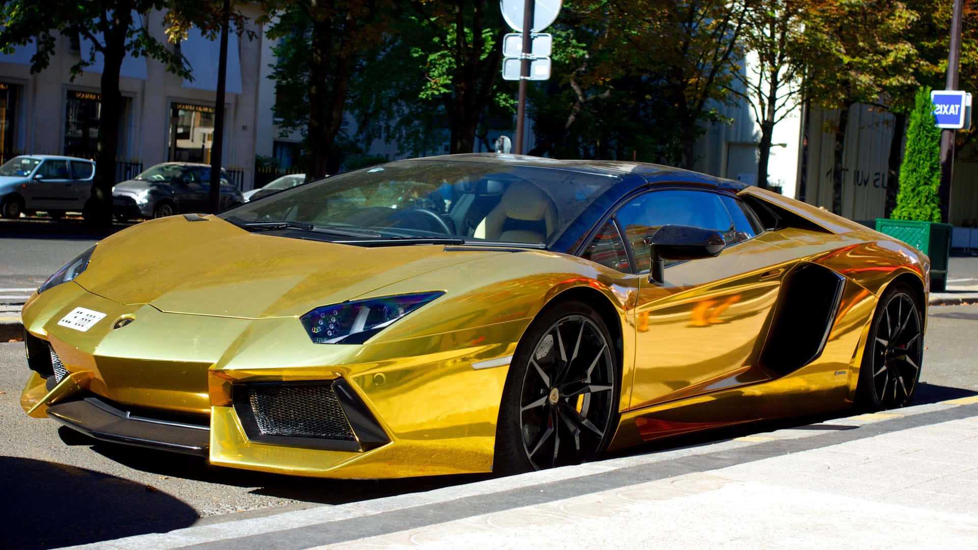 Fancy Gold Lamborghini Spotted On The Streets Background