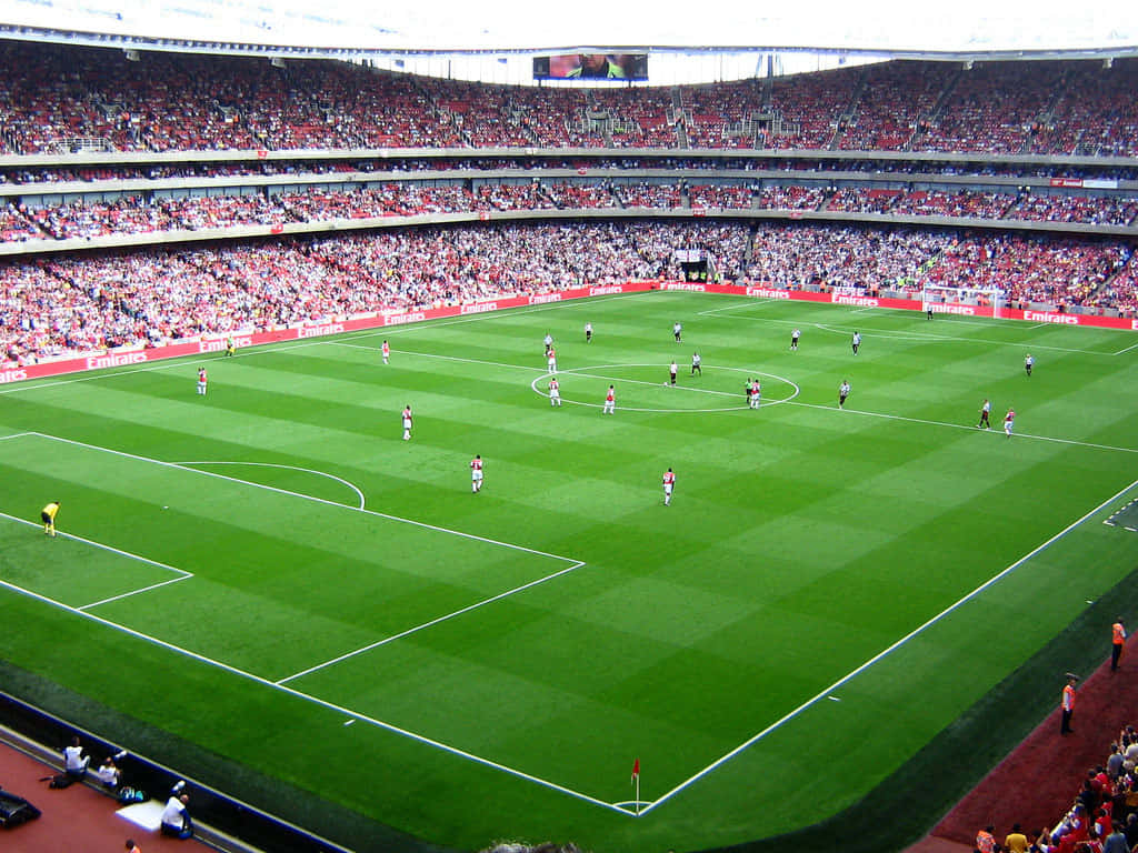 Fans Cheering In A Full Soccer Stadium Background