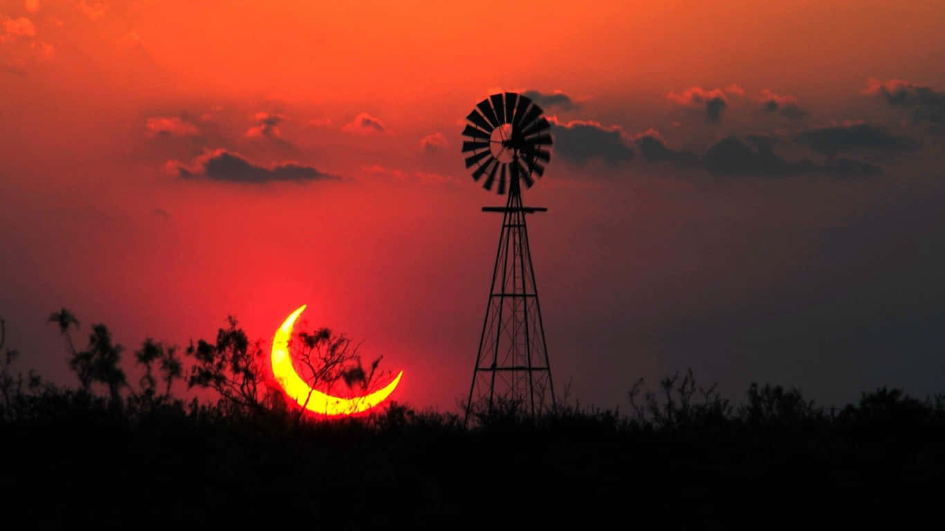 Farm Windmill Under Evening Sky Background