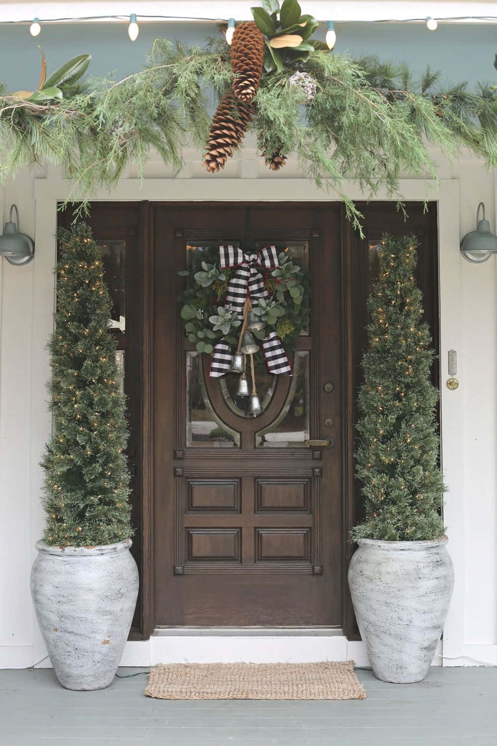 Farmhouse Christmas House With Plants In Vases Background