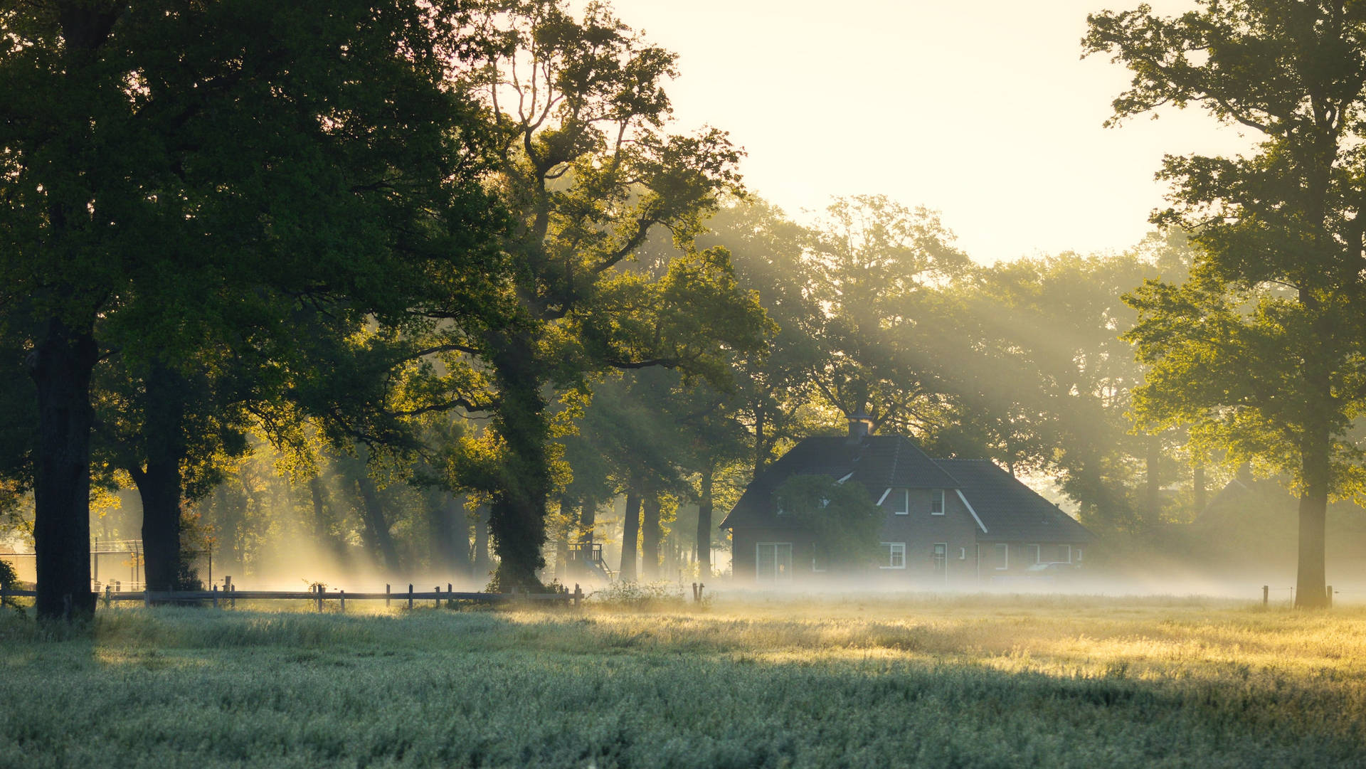 Farmhouse In A Foggy Forest Background