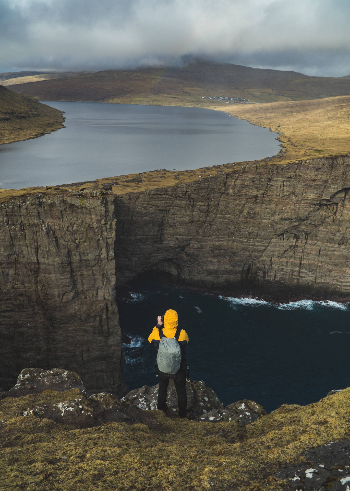 Faroe Islands Tourist In Cliff Background