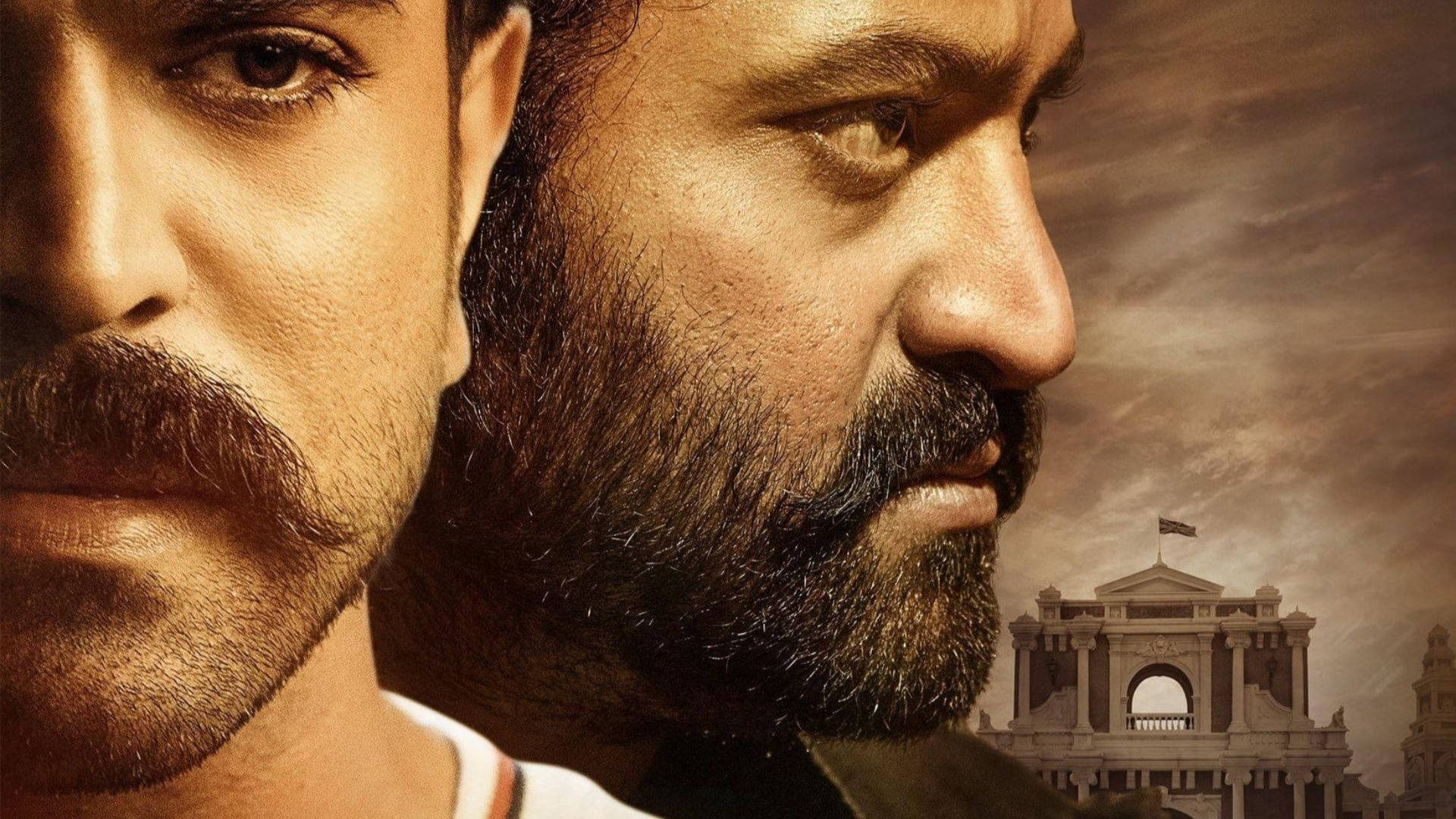 Fascinating Close-up Shot Of Ram Charan And N.t. Rama Side Faces In High-definition. Background