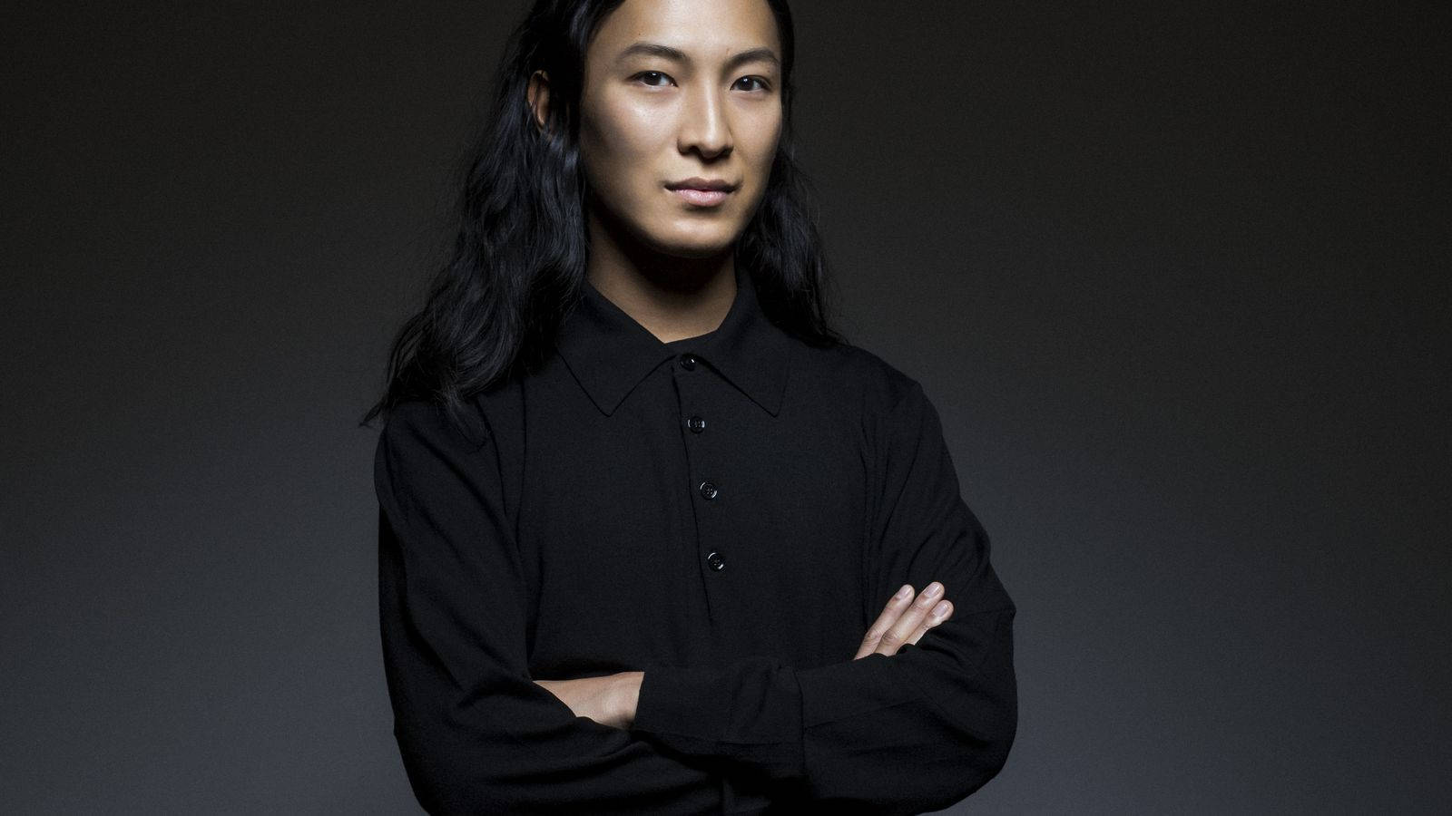 Fashion Designer Alexander Wang Confidently Standing With Arms Crossed