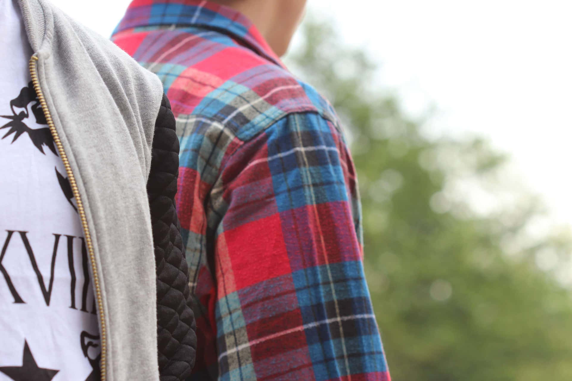 Fashion-forward Man In A Stylish Flannel Shirt. Background