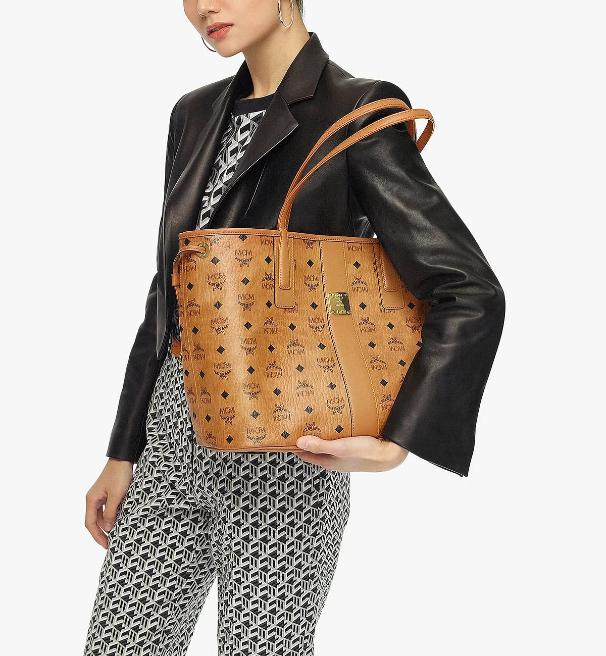 Fashion Forward - Model Showcasing Mcm Shoulder Bag Background