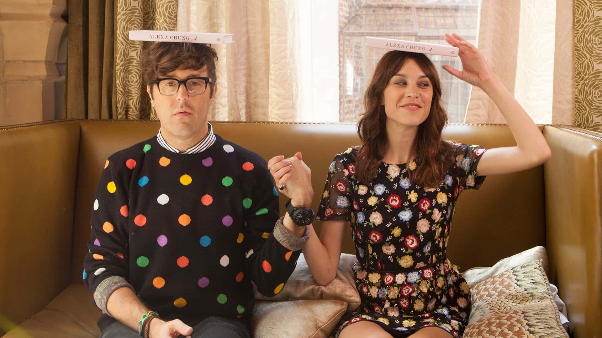 Fashion Icon Alexa Chung Posing Stylishly At An Event Background