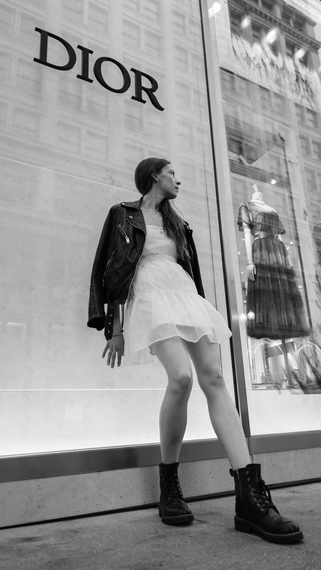 Fashionable Woman Outdoors Dior Storefront Background