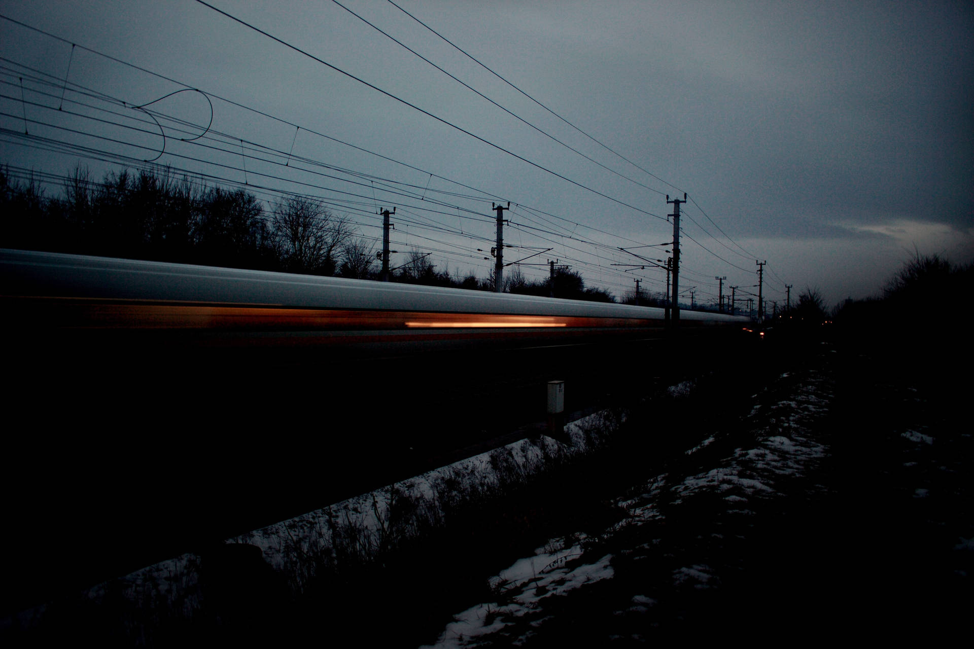 Fast Train Speeding Through The Night Background