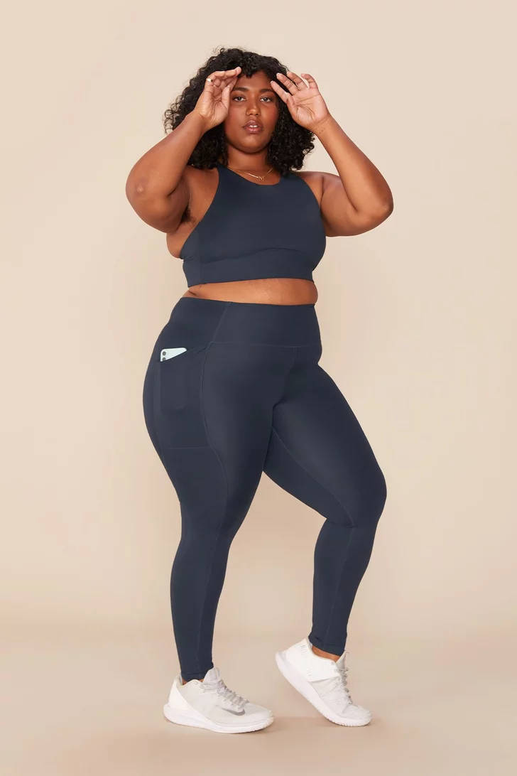 Fat Black Woman In Sporty Attire Background