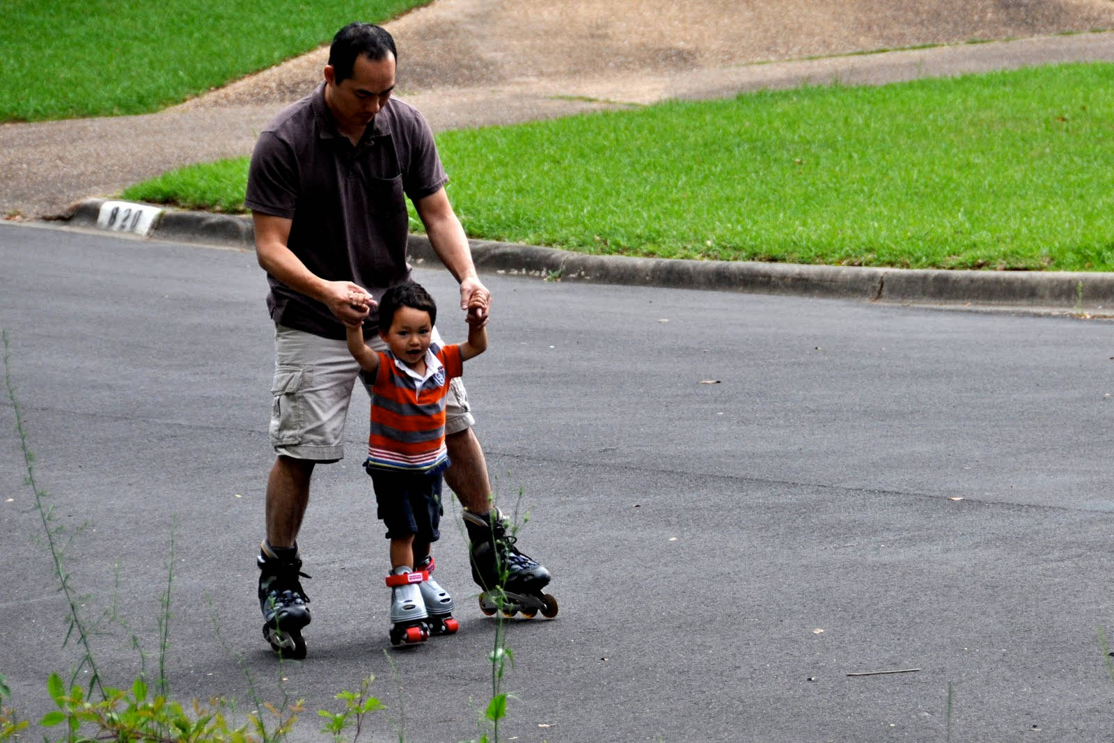 Father Teaching Son Rollerblading