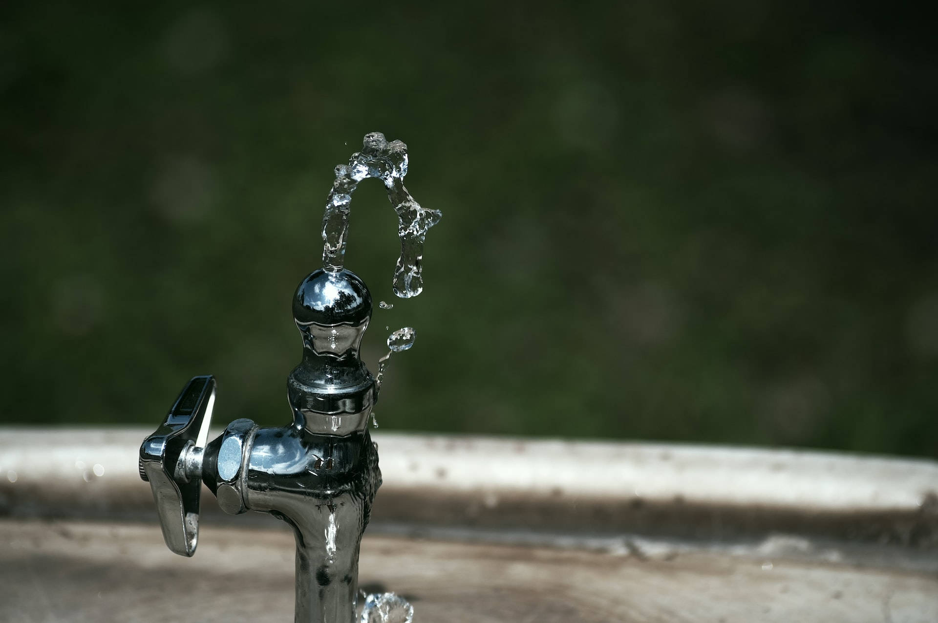 Faucet And Moving Water Background