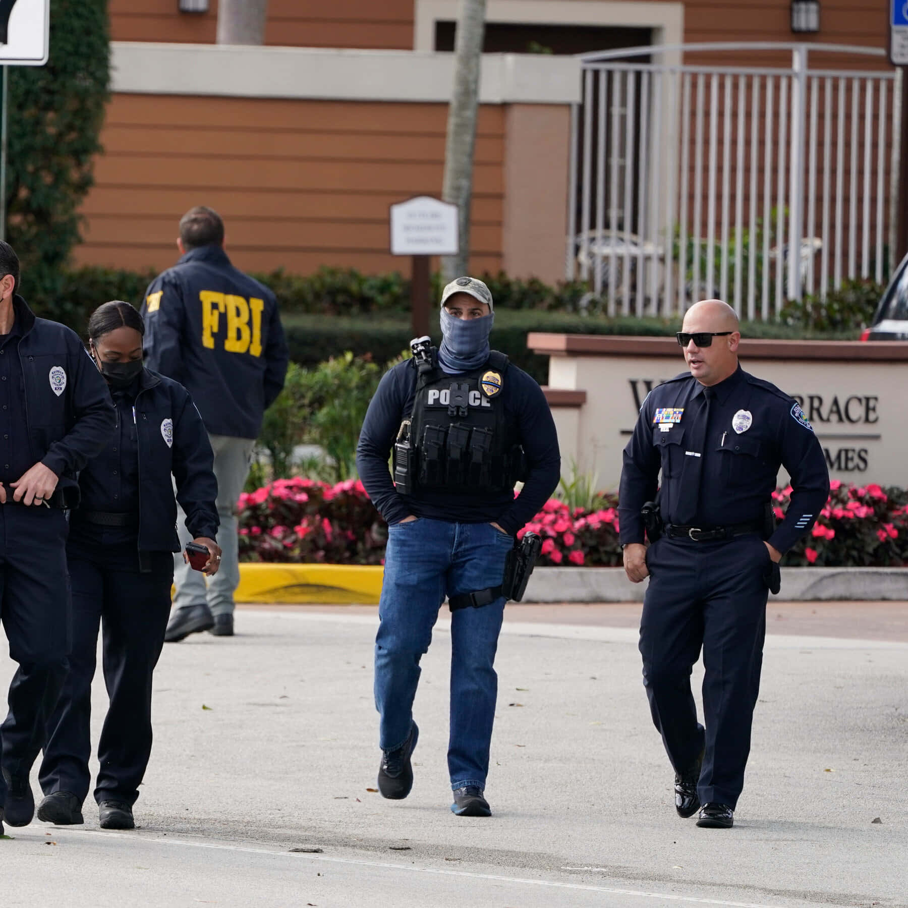 Fbi Agents Walk Down The Street In Uniform