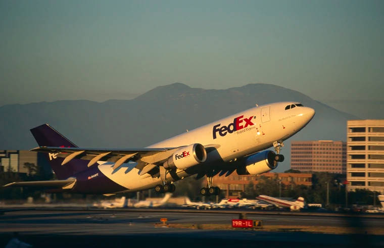 Fedex Delivery Van In Transit Background