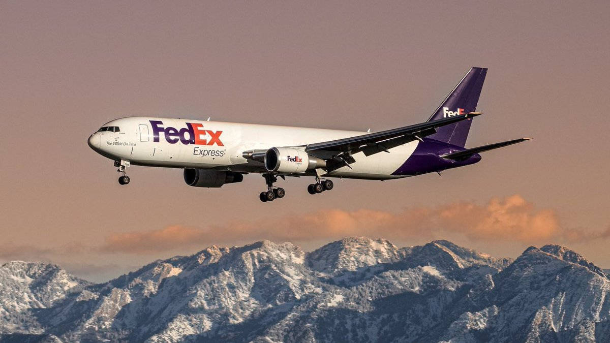 Fedex Delivery Van On The Street. Background