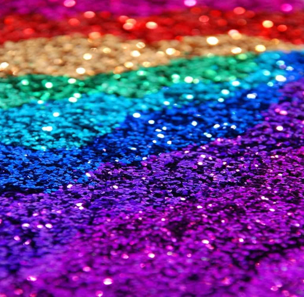 Feel The Beauty And Magic Of A Rainbow Reflected In A Glittery Texture. Background