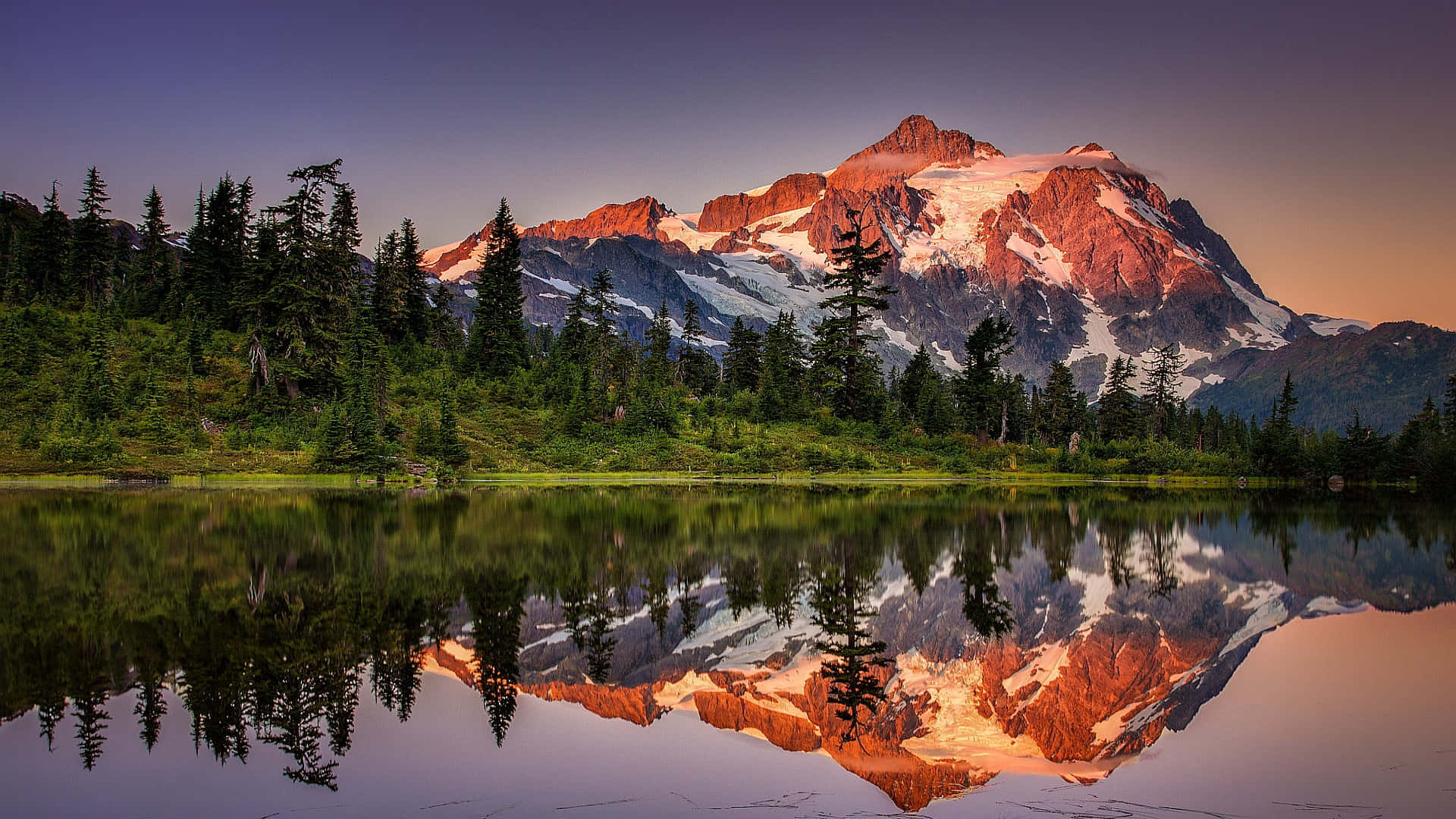 Feel The Beauty Of The Majestic Mountains And Pristine Lake Background